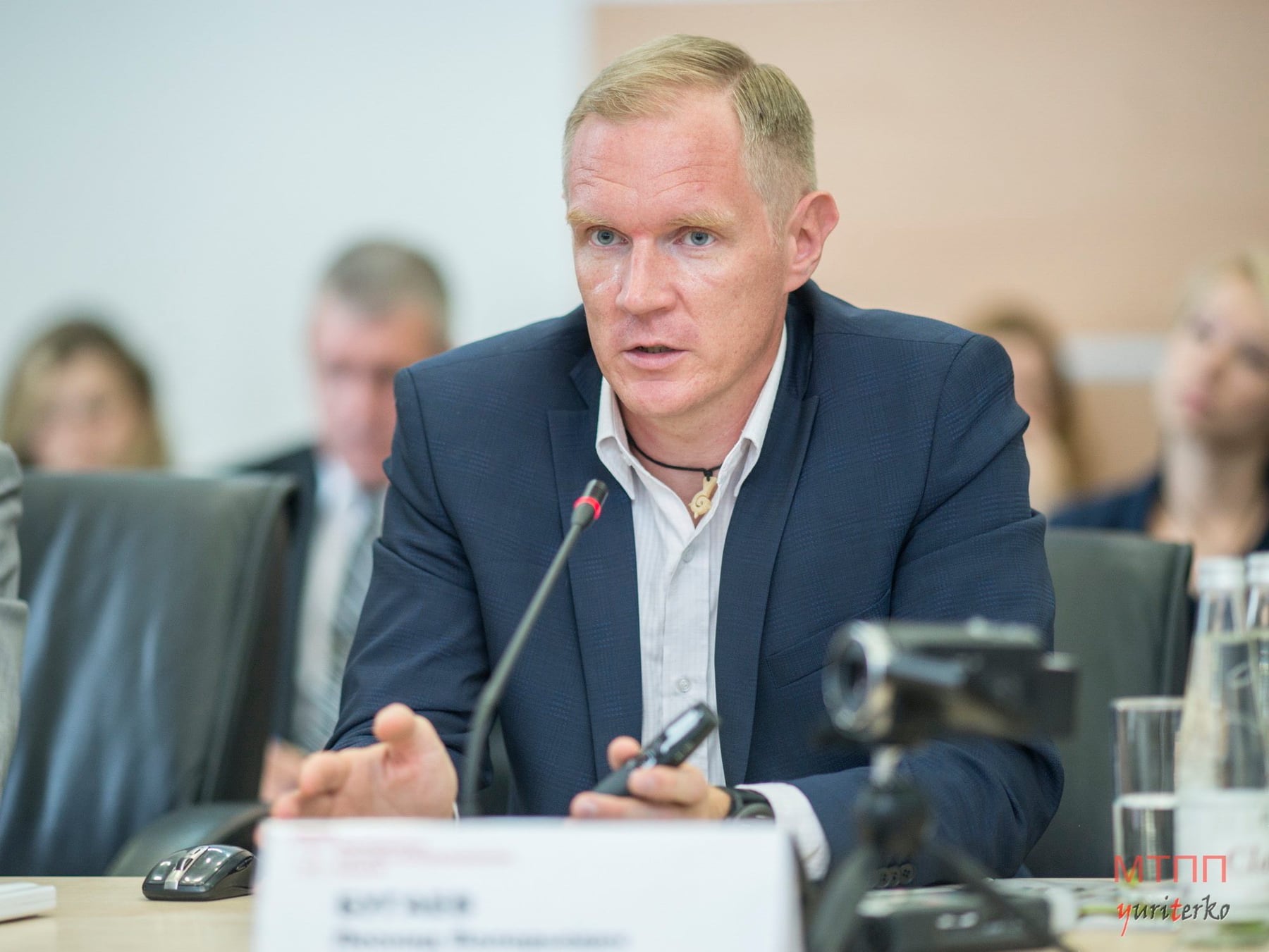 Leonid Bugaev speaking at a business event