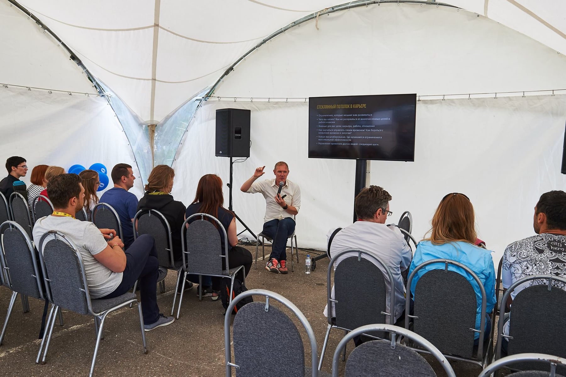 Leonid Bugaev speaking at a business event