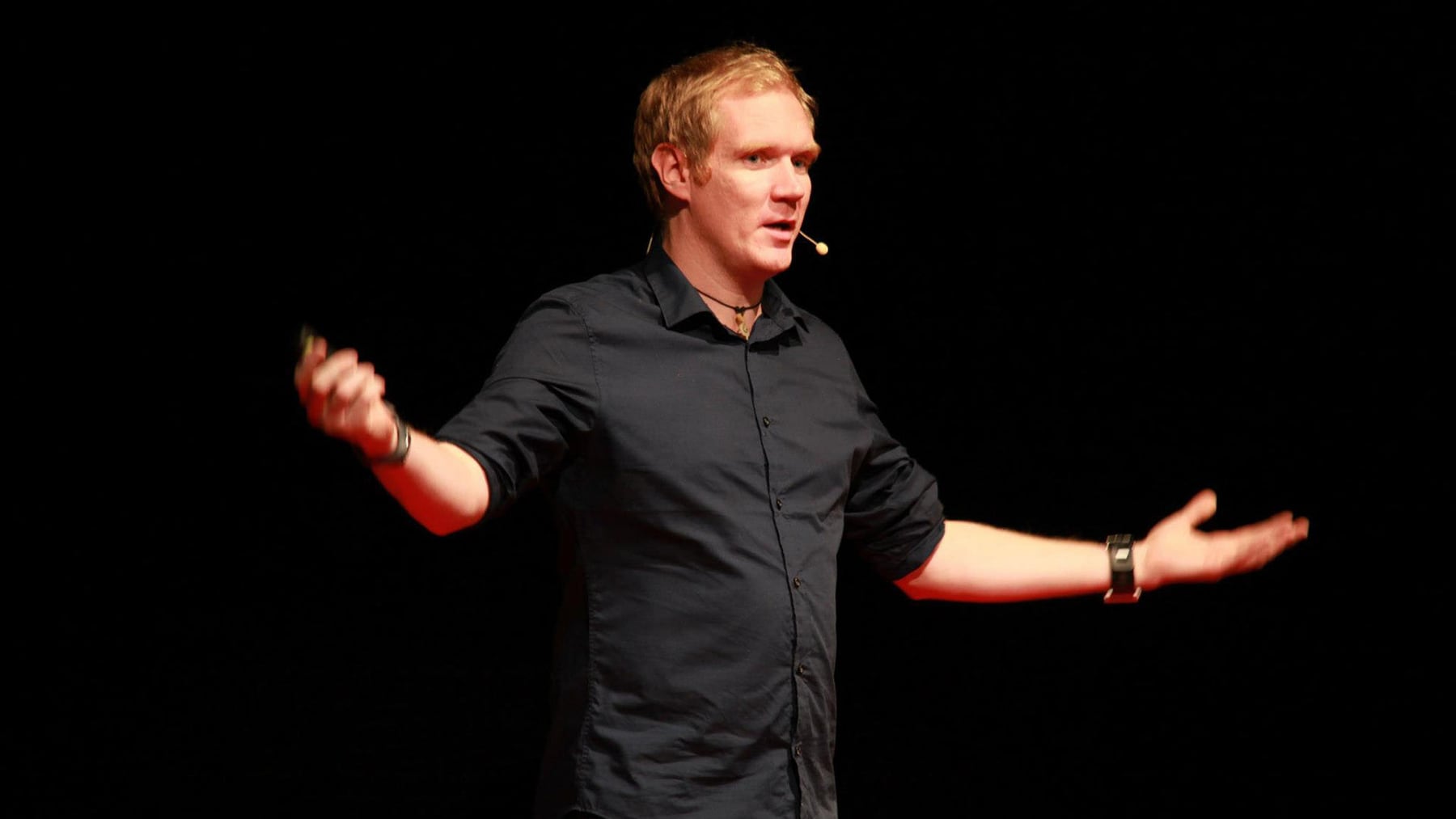 Leonid Bugaev speaking at a business event