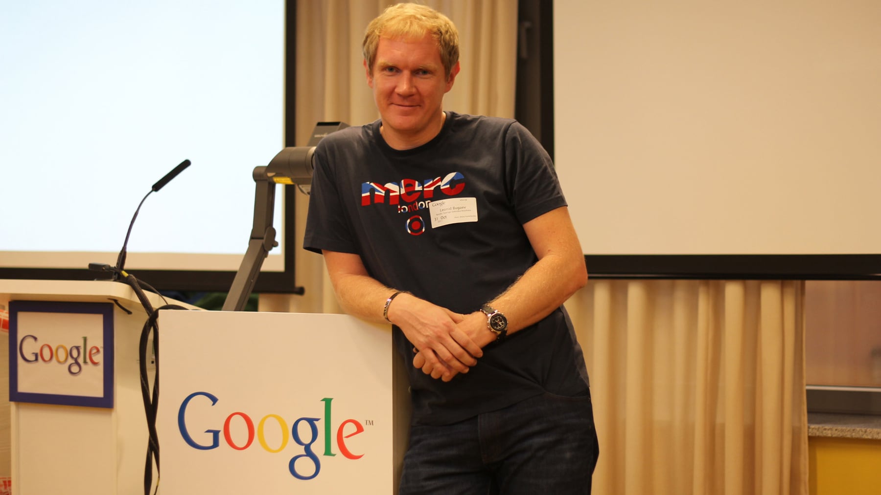 Leonid Bugaev speaking at a business event